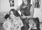 Students get free haircuts before school starts